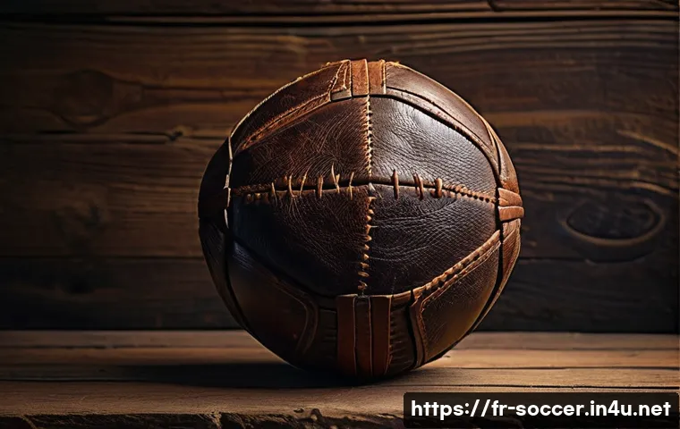 축구 공의 역사 - A detailed, close-up image of a traditional handcrafted medieval football made from natural material...